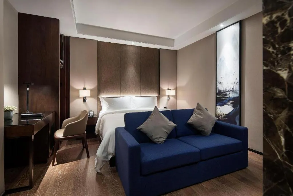 Bed in Zhonghao Boutique Hotel Dalang Business Center