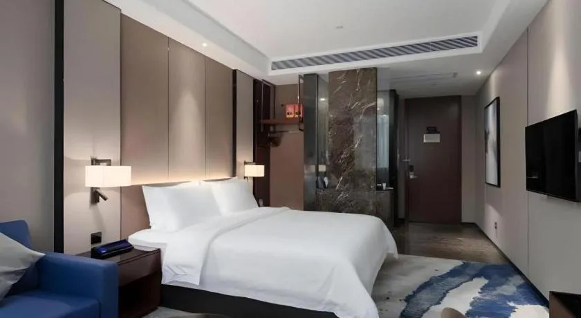 Bed in Zhonghao Boutique Hotel Dalang Business Center