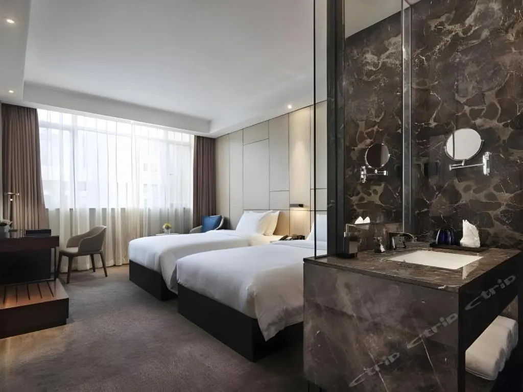 Bed in Zhonghao Boutique Hotel Dalang Business Center