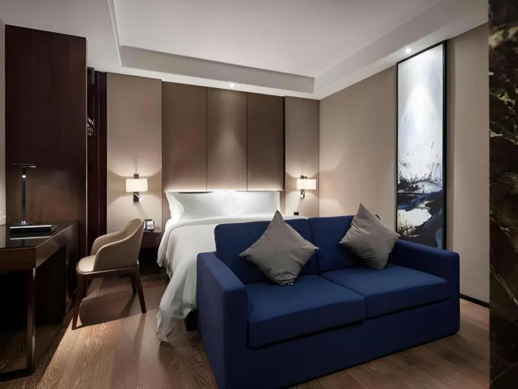 Bed in Zhonghao Boutique Hotel Dalang Business Center