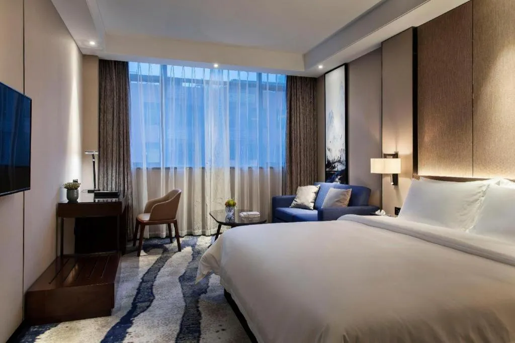 Bed in Zhonghao Boutique Hotel Dalang Business Center