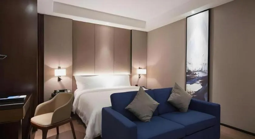 Bed in Zhonghao Boutique Hotel Dalang Business Center