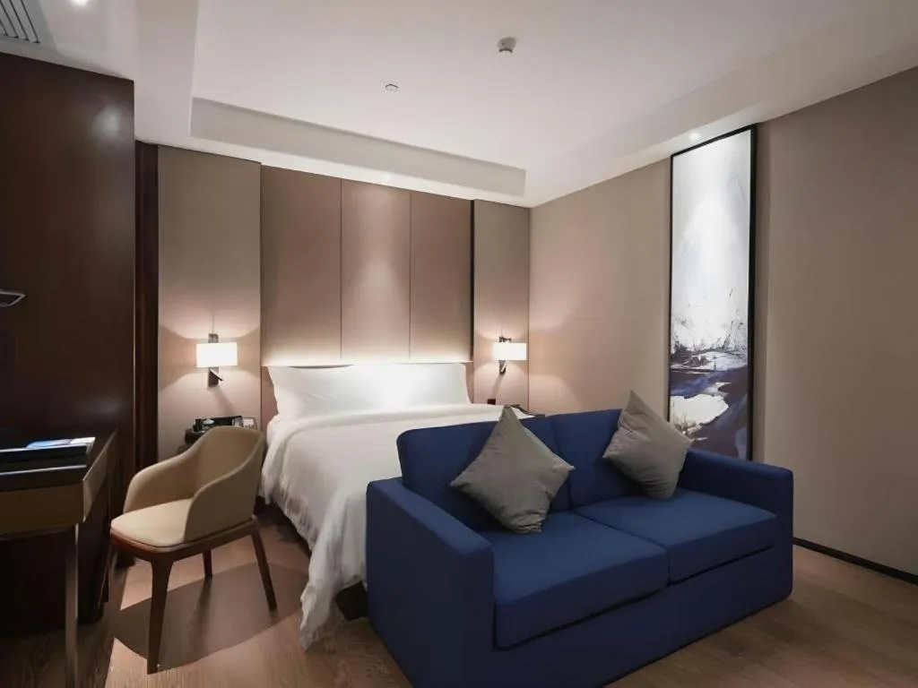 Bed in Zhonghao Boutique Hotel Dalang Business Center