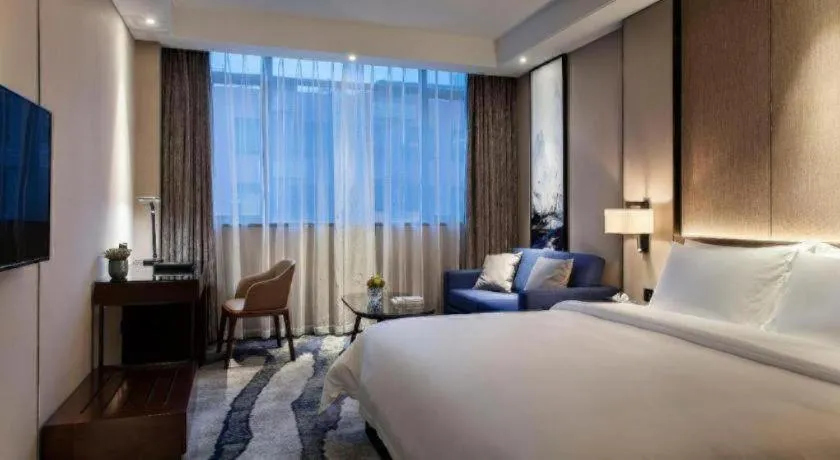 Bed in Zhonghao Boutique Hotel Dalang Business Center