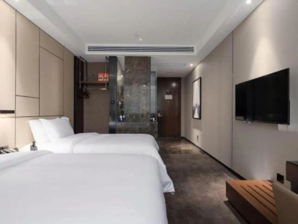 Bed in Zhonghao Boutique Hotel Dalang Business Center