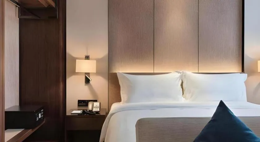 Bed in Zhonghao Boutique Hotel Dalang Business Center