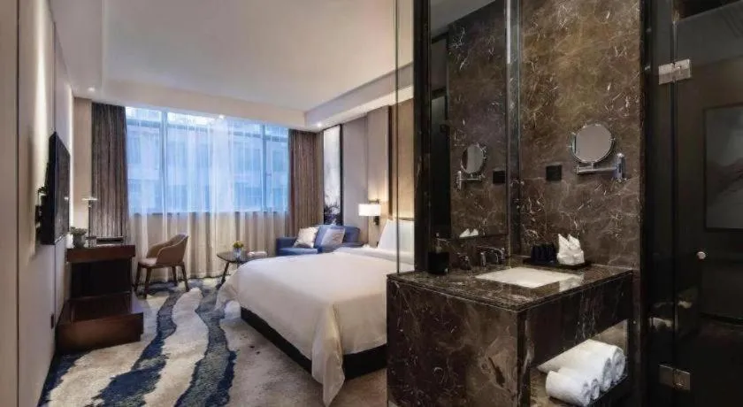 Bed in Zhonghao Boutique Hotel Dalang Business Center