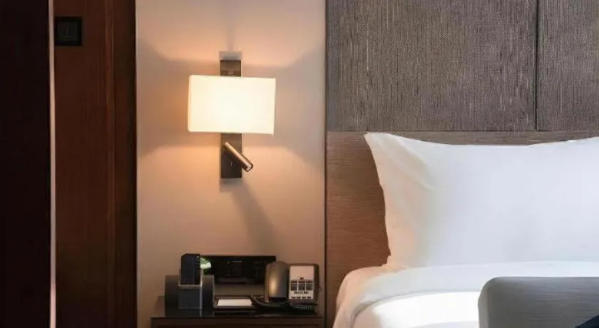 Bed in Zhonghao Boutique Hotel Dalang Business Center