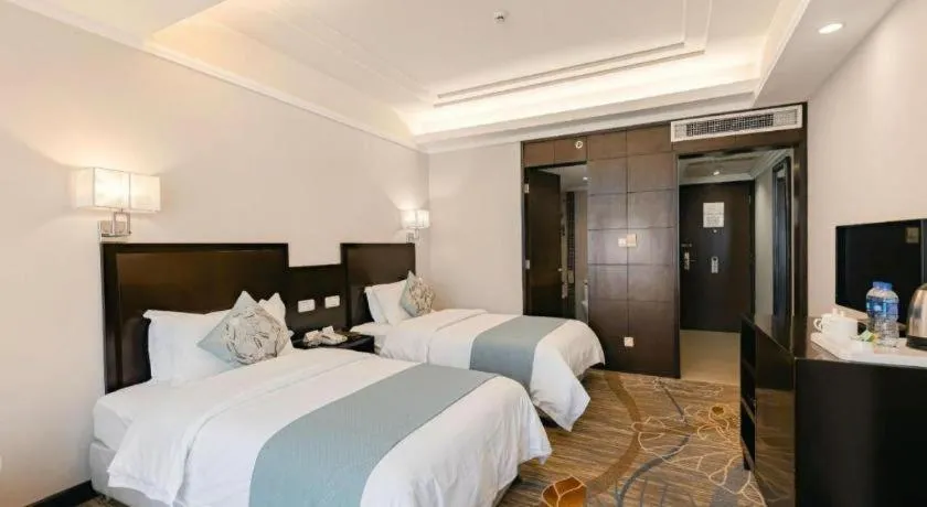 Bed in New Century Pujiang Hotel