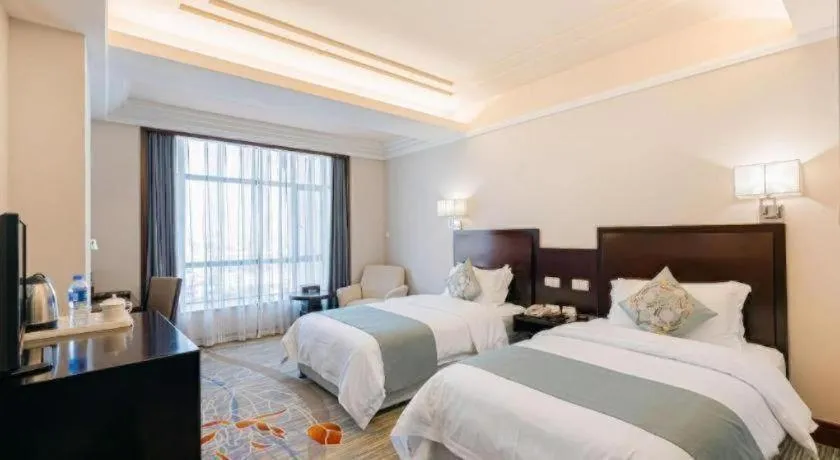 Bed in New Century Pujiang Hotel