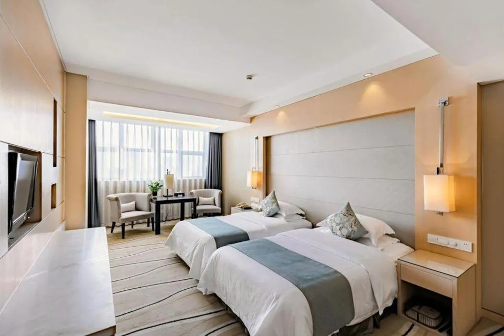 Bed in New Century Pujiang Hotel