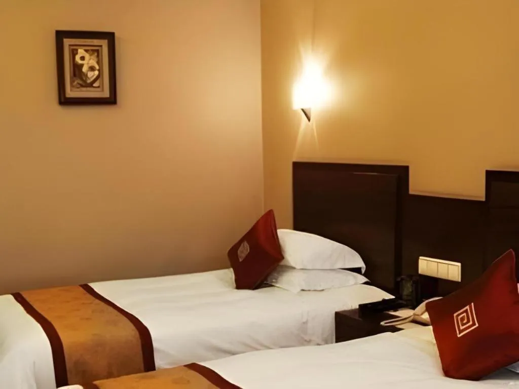 Bed in New Century Pujiang Hotel