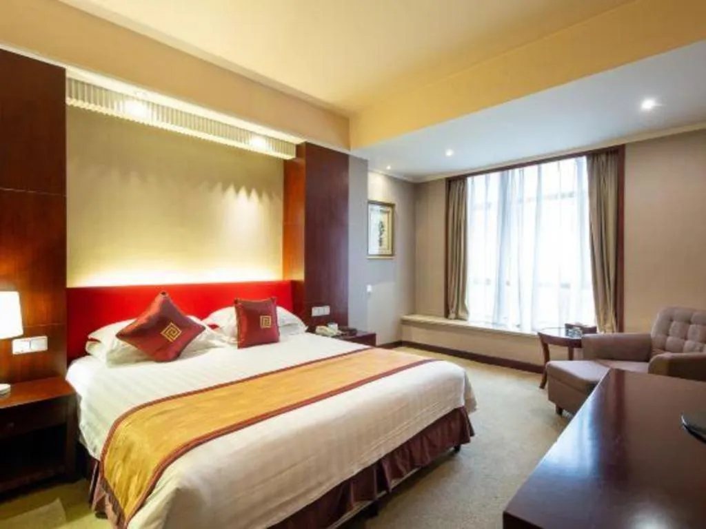 Bed in New Century Pujiang Hotel