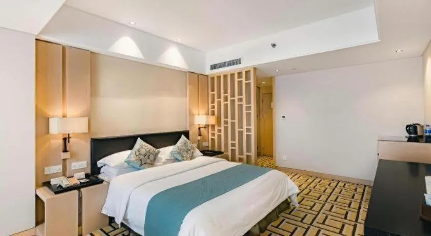Bed in New Century Pujiang Hotel