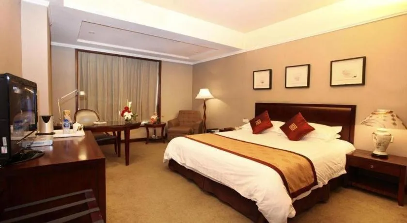 Bed in New Century Pujiang Hotel
