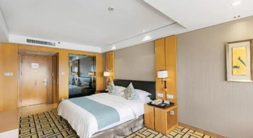 Bed in New Century Pujiang Hotel