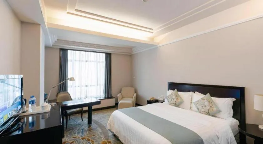 Bed in New Century Pujiang Hotel