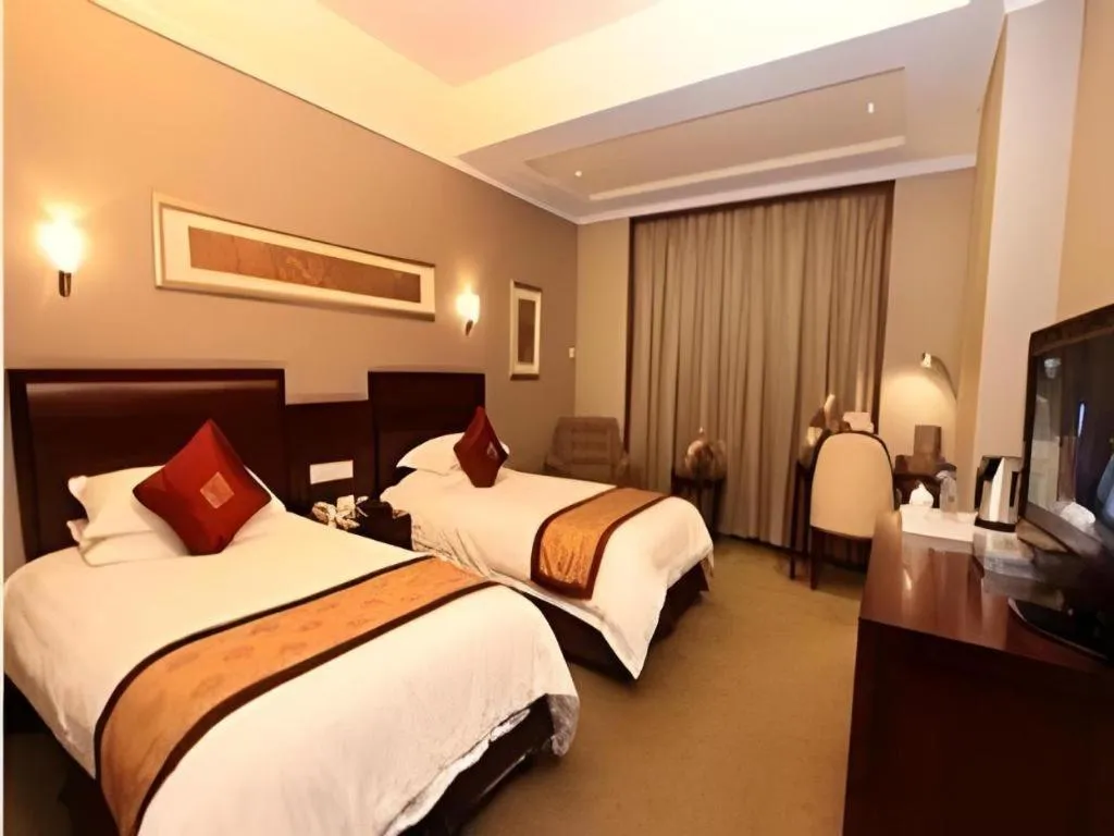 Bed in New Century Pujiang Hotel