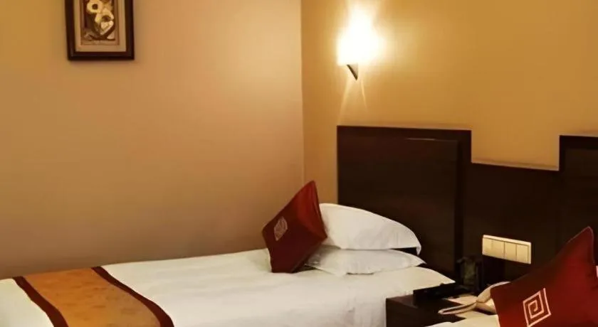 Bed in New Century Pujiang Hotel