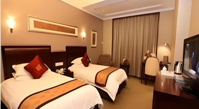 Bed in New Century Pujiang Hotel