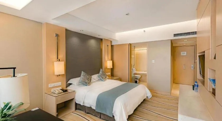 Bed in New Century Pujiang Hotel