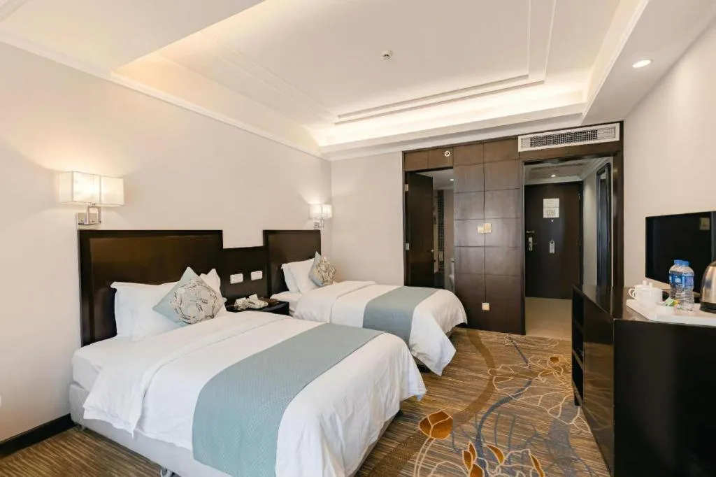 Bed in New Century Pujiang Hotel