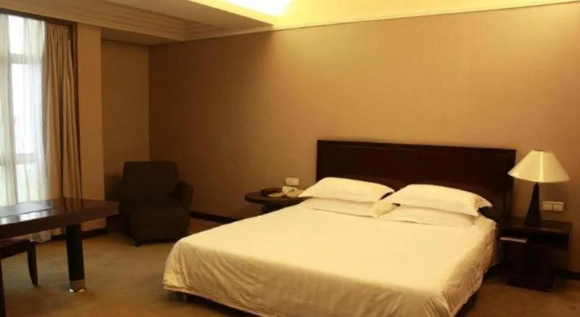Bed in New Century Pujiang Hotel