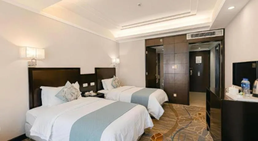 Bed in New Century Pujiang Hotel