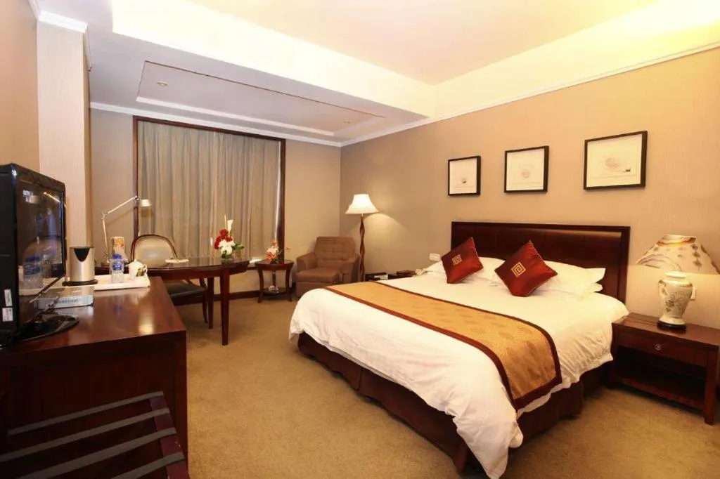 Bed in New Century Pujiang Hotel