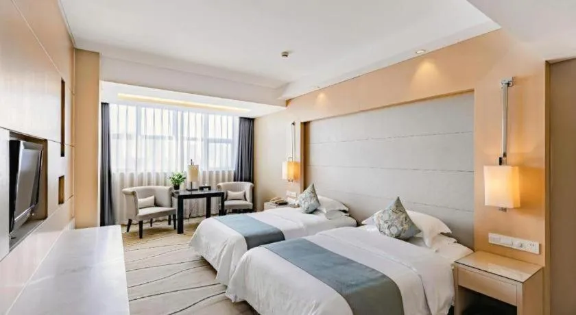 Bed in New Century Pujiang Hotel