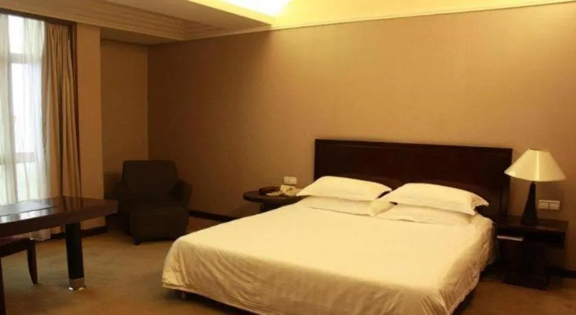 Bed in New Century Pujiang Hotel