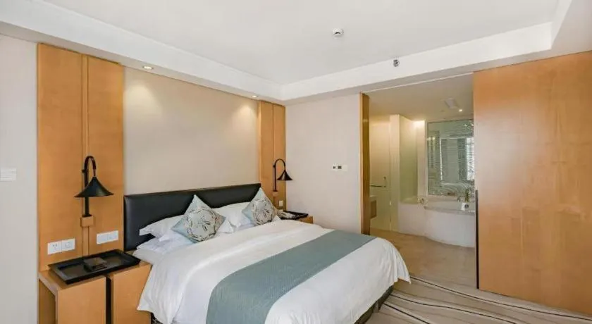 Bed in New Century Pujiang Hotel