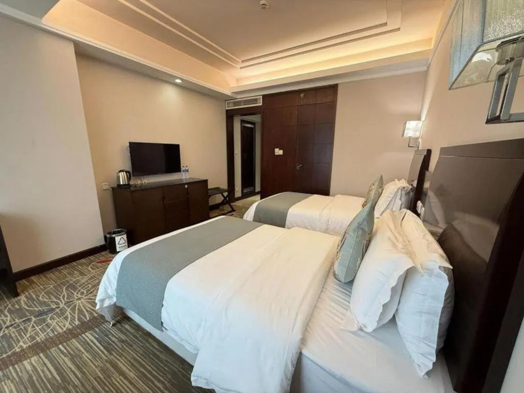 Bed in New Century Pujiang Hotel