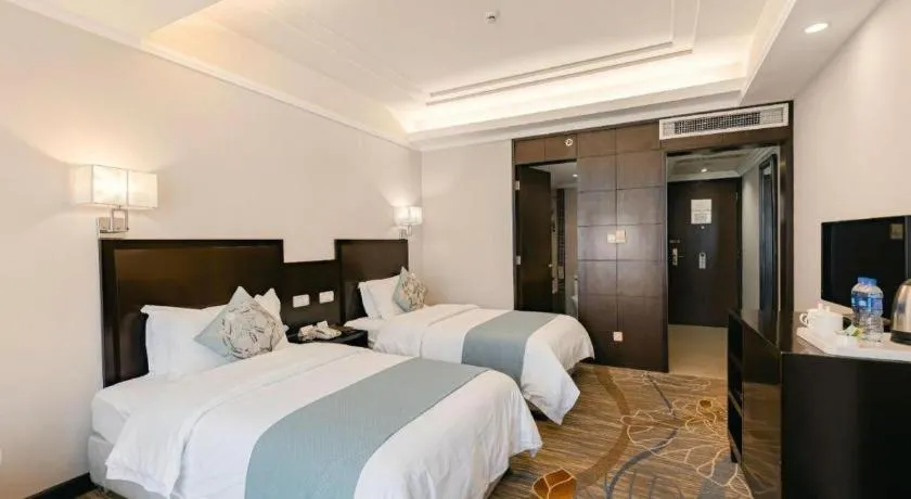 Bed in New Century Pujiang Hotel