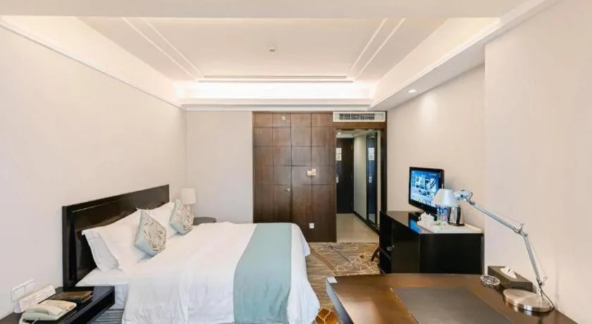 Bed in New Century Pujiang Hotel