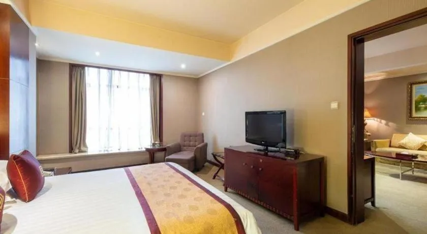 Bed in New Century Pujiang Hotel