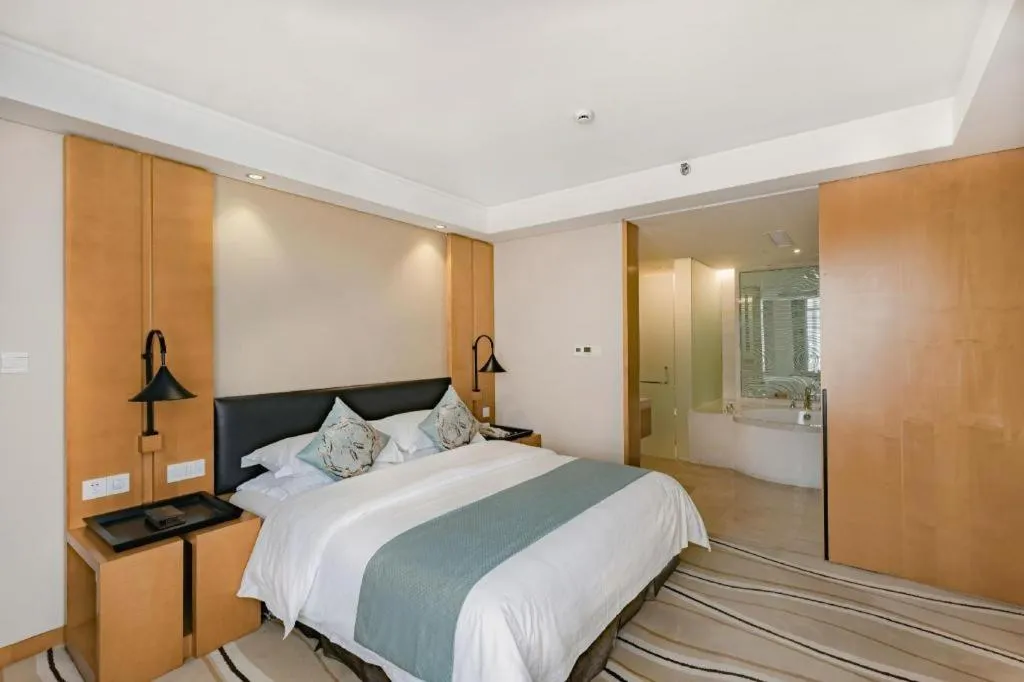 Bed in New Century Pujiang Hotel