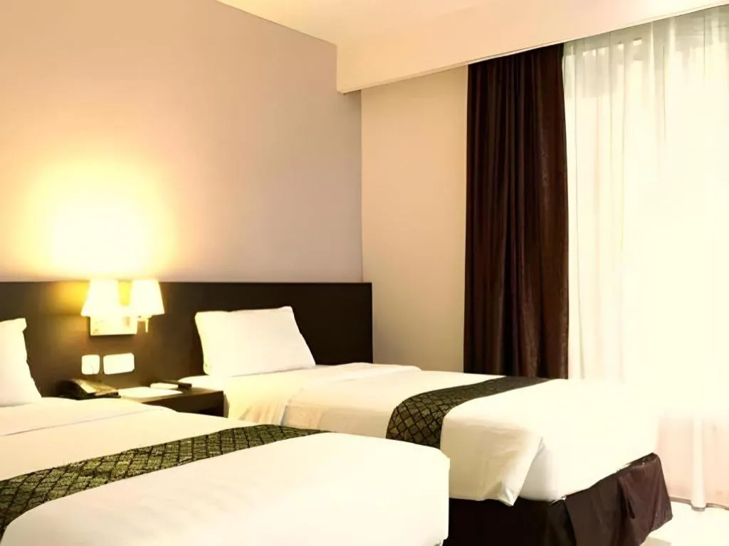 Bed in Grand Hawaii Hotel Pekanbaru