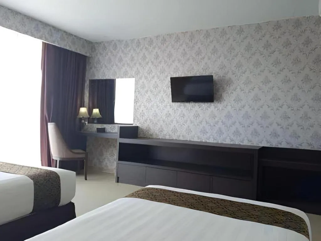 Bed in Grand Hawaii Hotel Pekanbaru