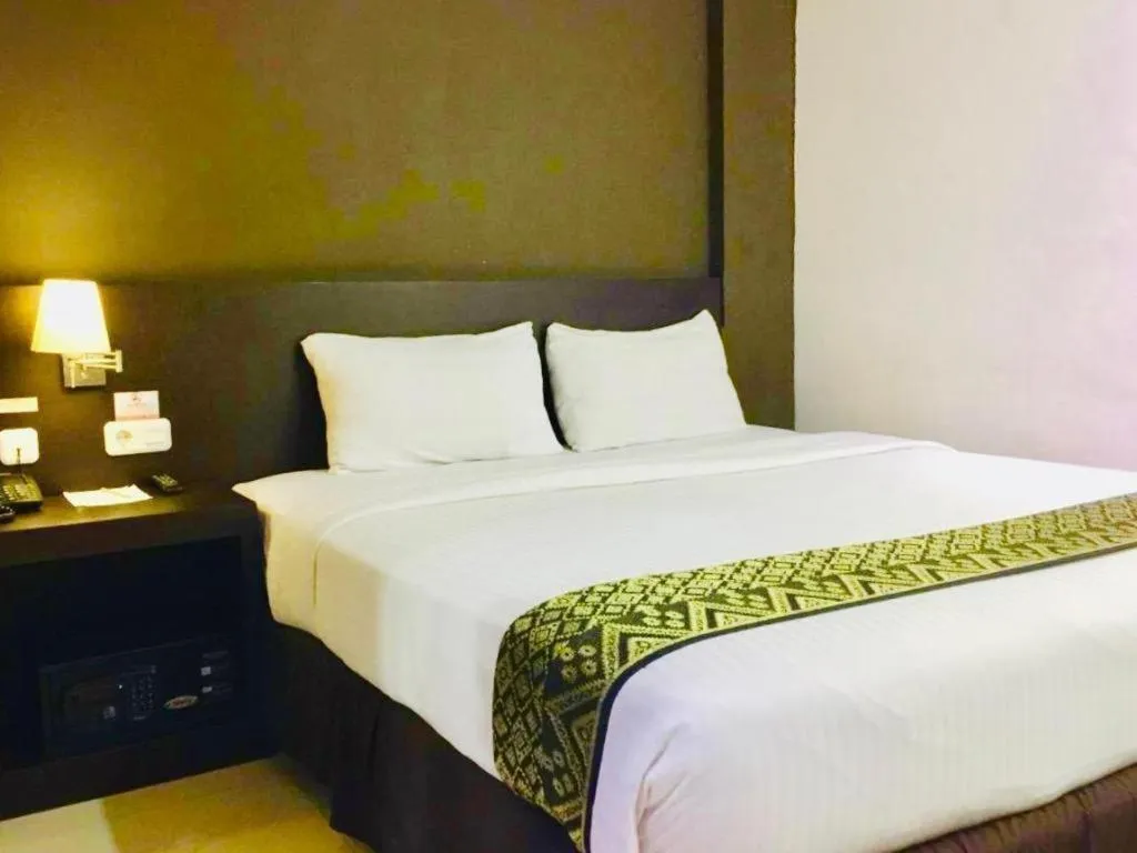 Bed in Grand Hawaii Hotel Pekanbaru