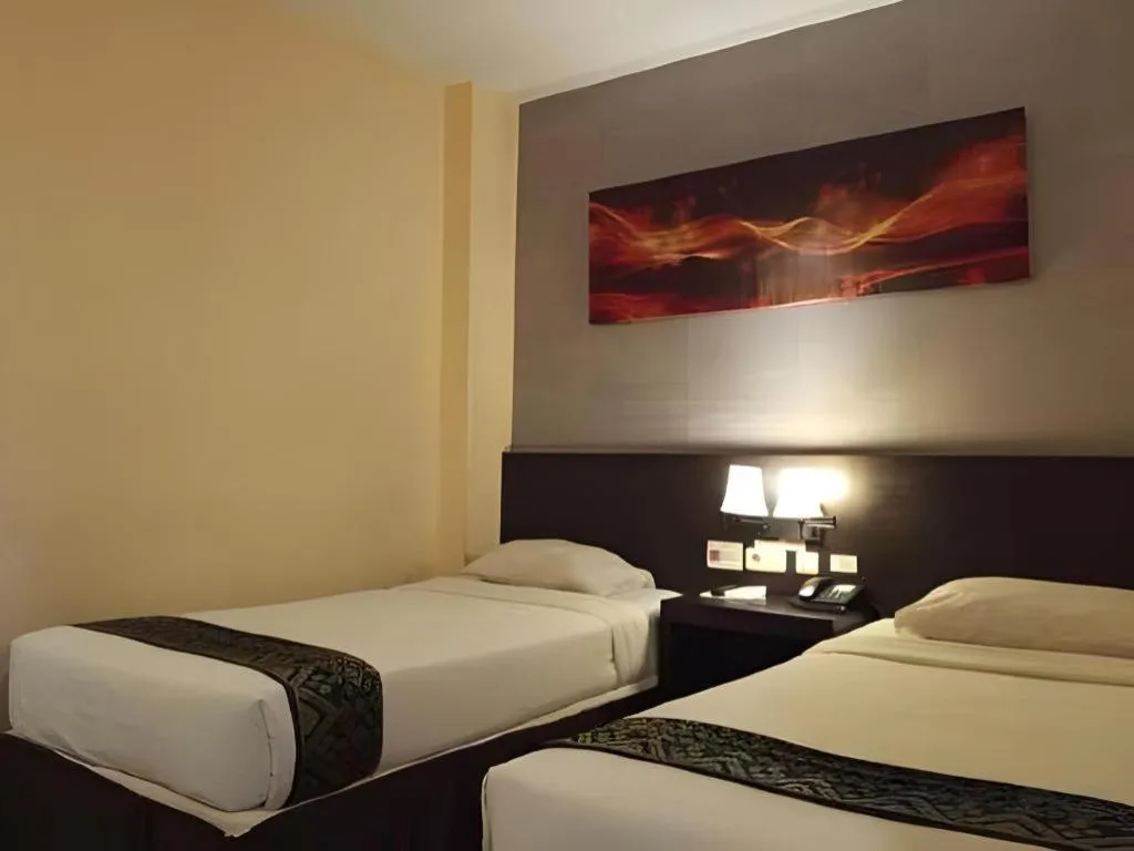 Bed in Grand Hawaii Hotel Pekanbaru