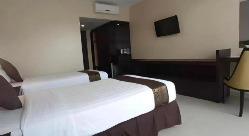 Bed in Grand Hawaii Hotel Pekanbaru