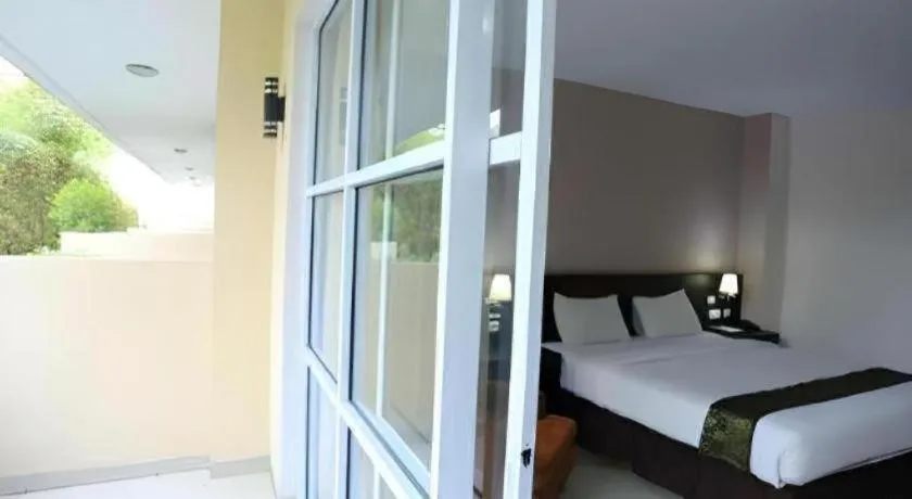 Bed in Grand Hawaii Hotel Pekanbaru