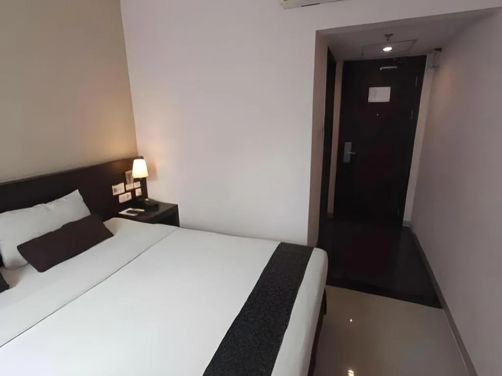 Bed in Grand Hawaii Hotel Pekanbaru