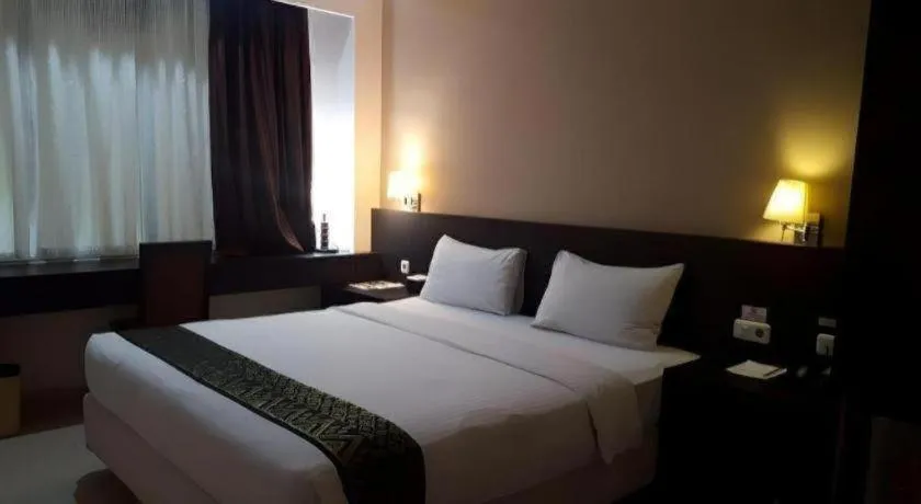 Bed in Grand Hawaii Hotel Pekanbaru