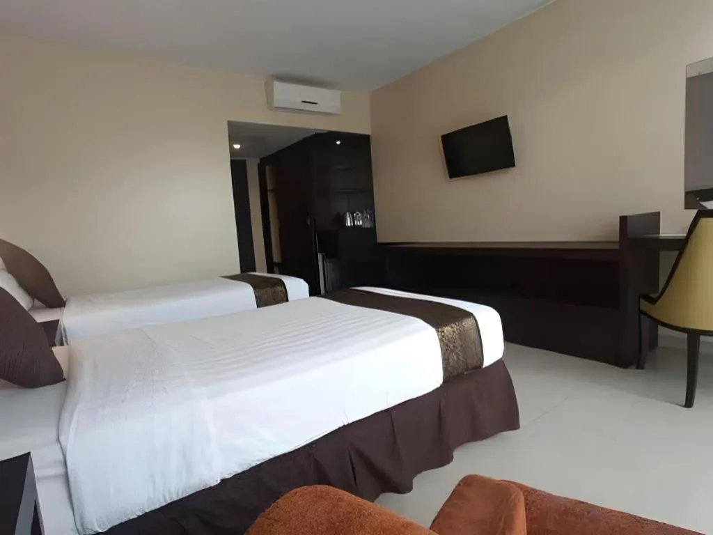 Bed in Grand Hawaii Hotel Pekanbaru