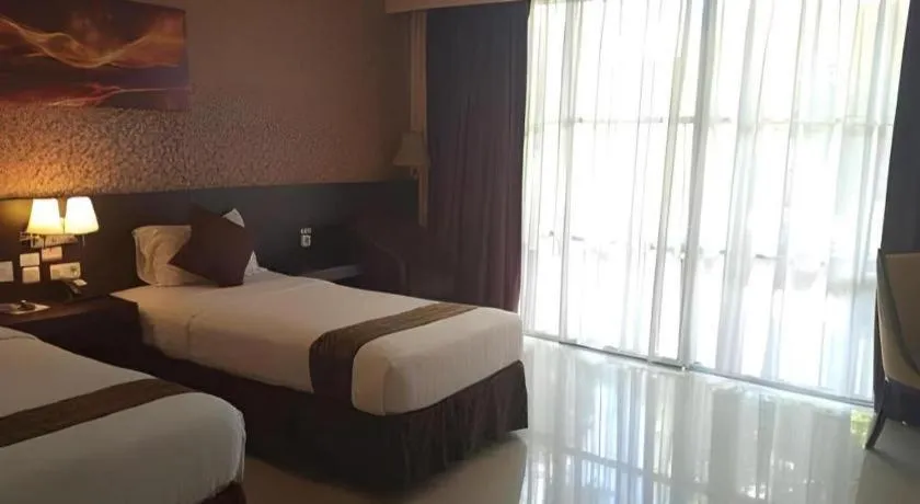 Bed in Grand Hawaii Hotel Pekanbaru