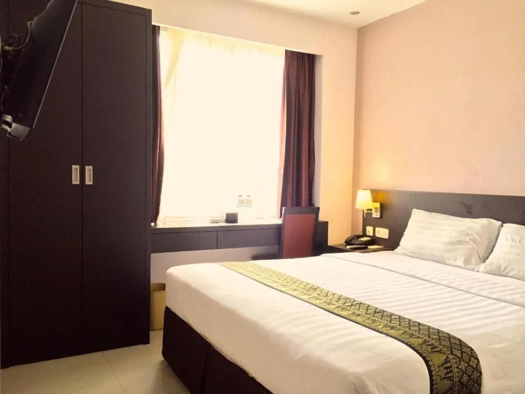 Bed in Grand Hawaii Hotel Pekanbaru