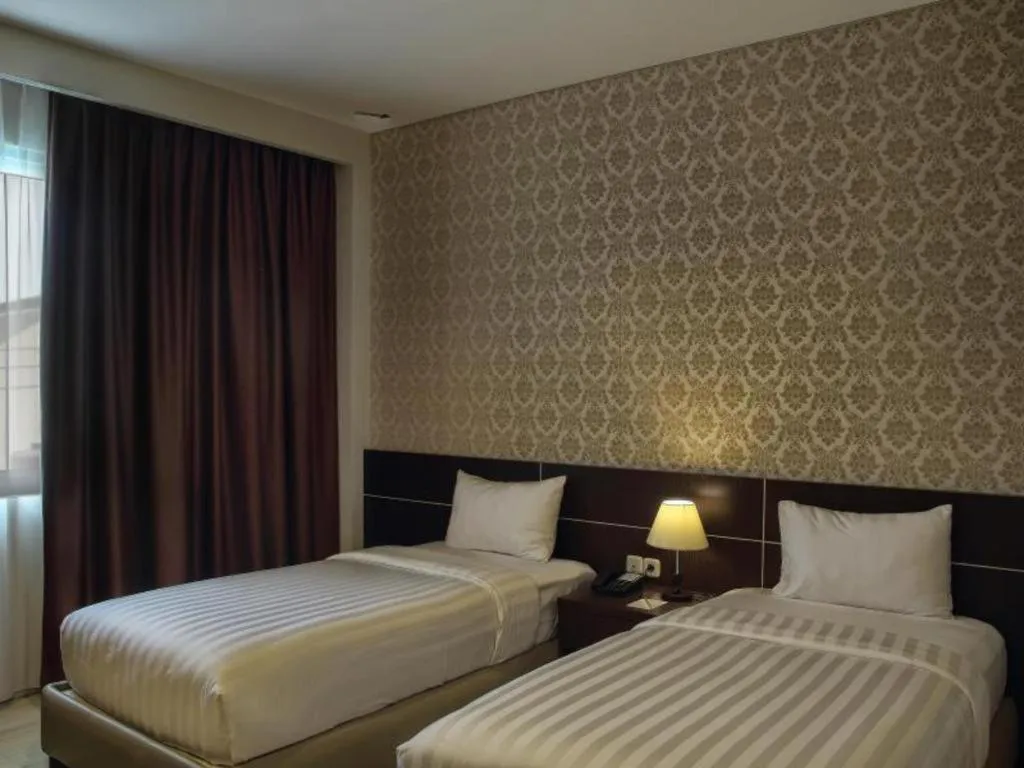 Bed in Asoka Luxury Hotel