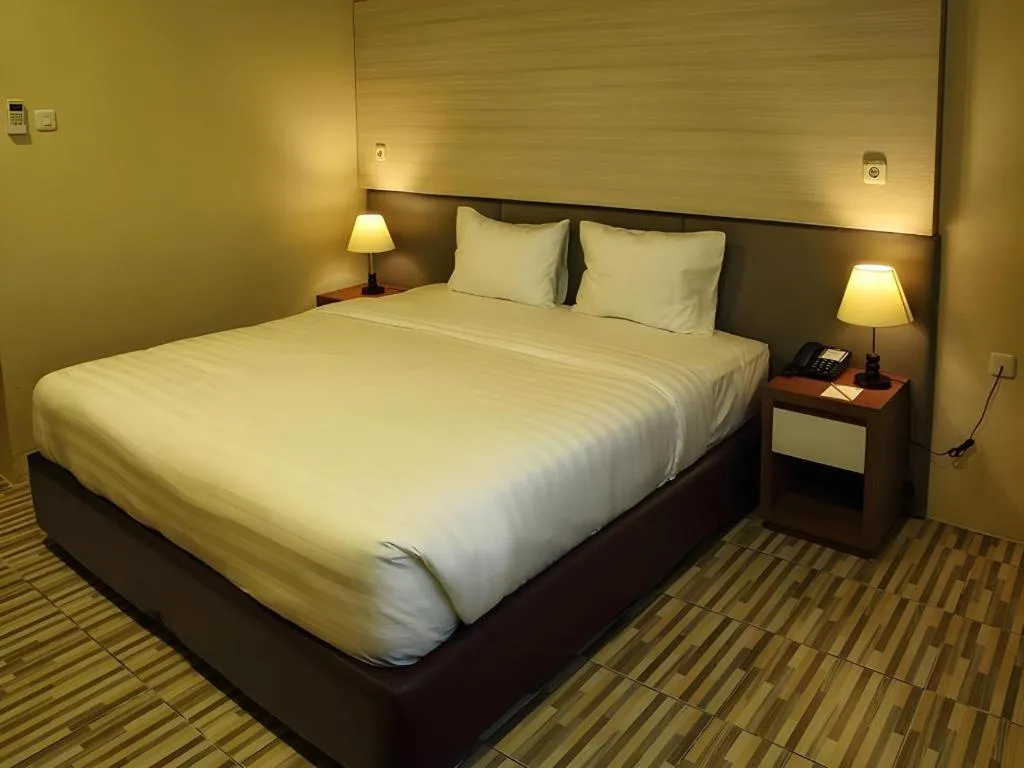 Bed in Asoka Luxury Hotel